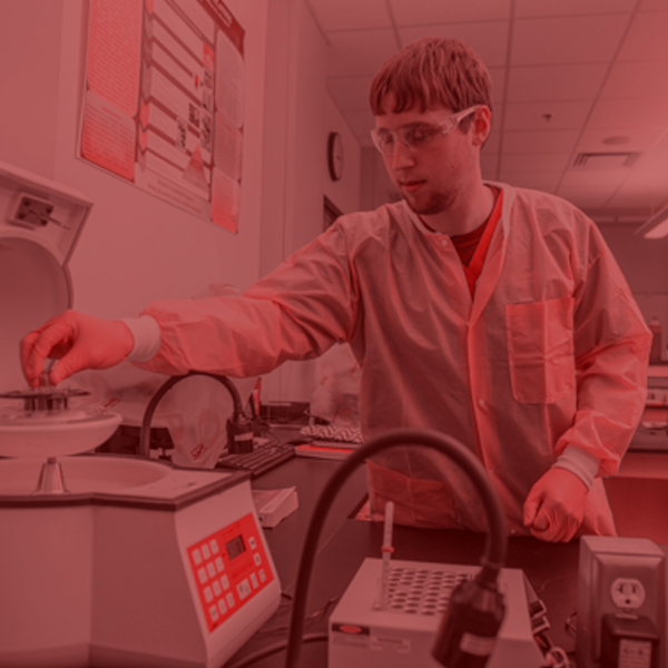 student using lab equipment