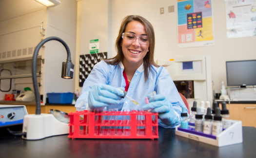Student analyzing test samples