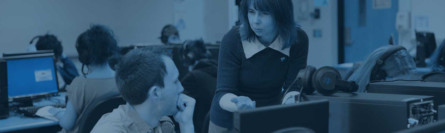 Students and professor working on language exercises