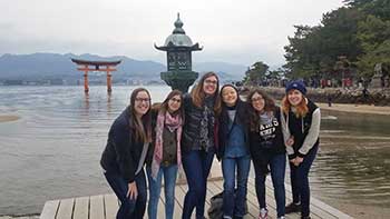Natasha Riegle with friends at Itsukushima Shrine. 