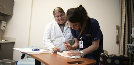 Lange with a student