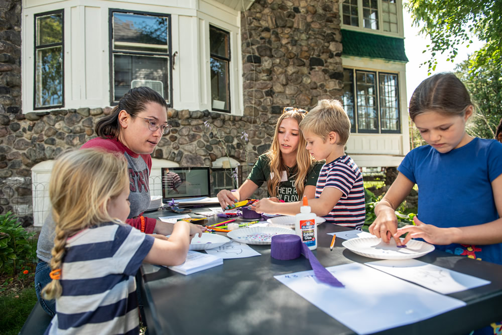 Alyssa Crawford and Lexie Dropps teach an arts and crafts project