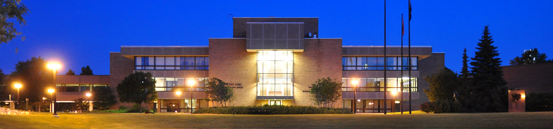Wickes Hall at SVSU, lit up at night 