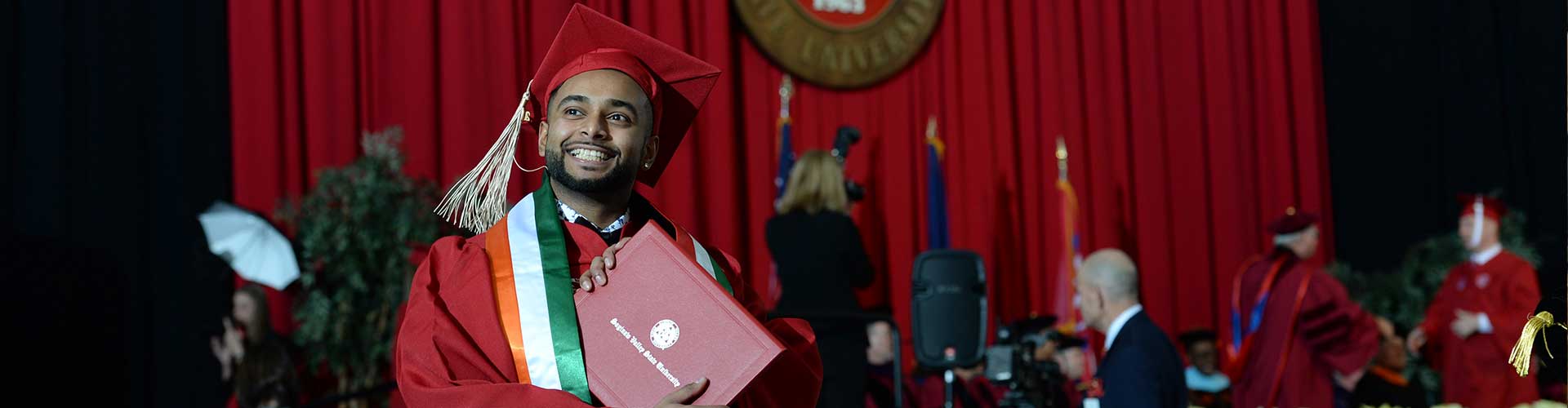 Student holding diploma