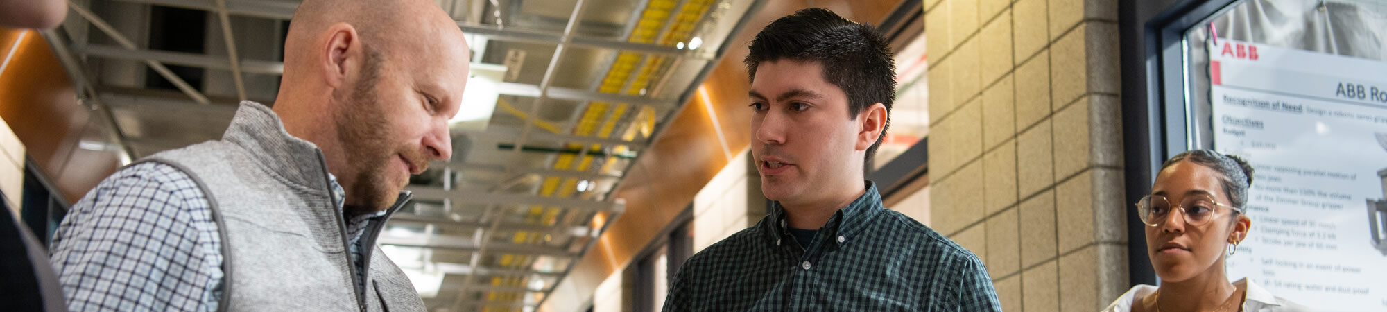 Students with faculty at presentation