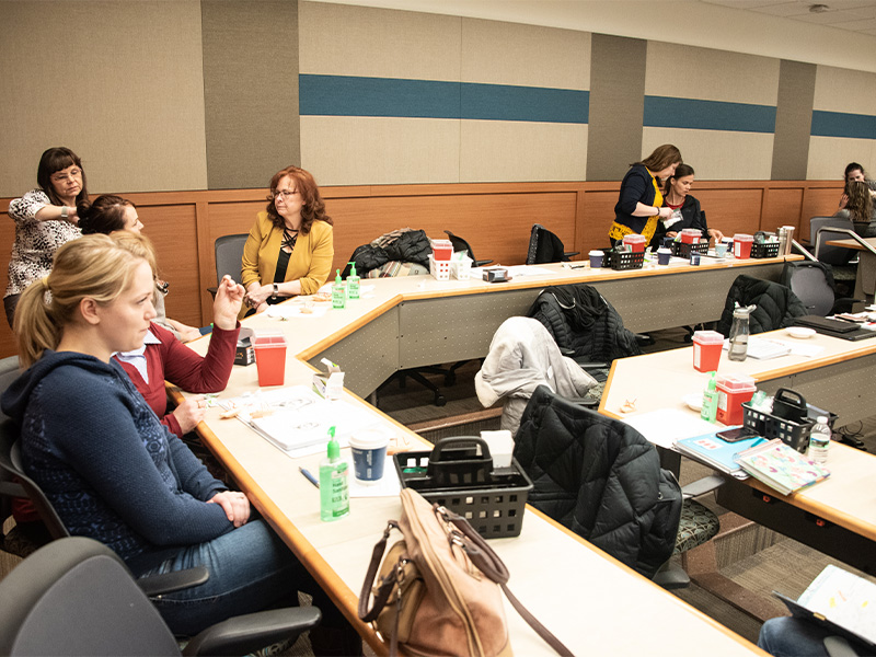 Students practicing acupuncture