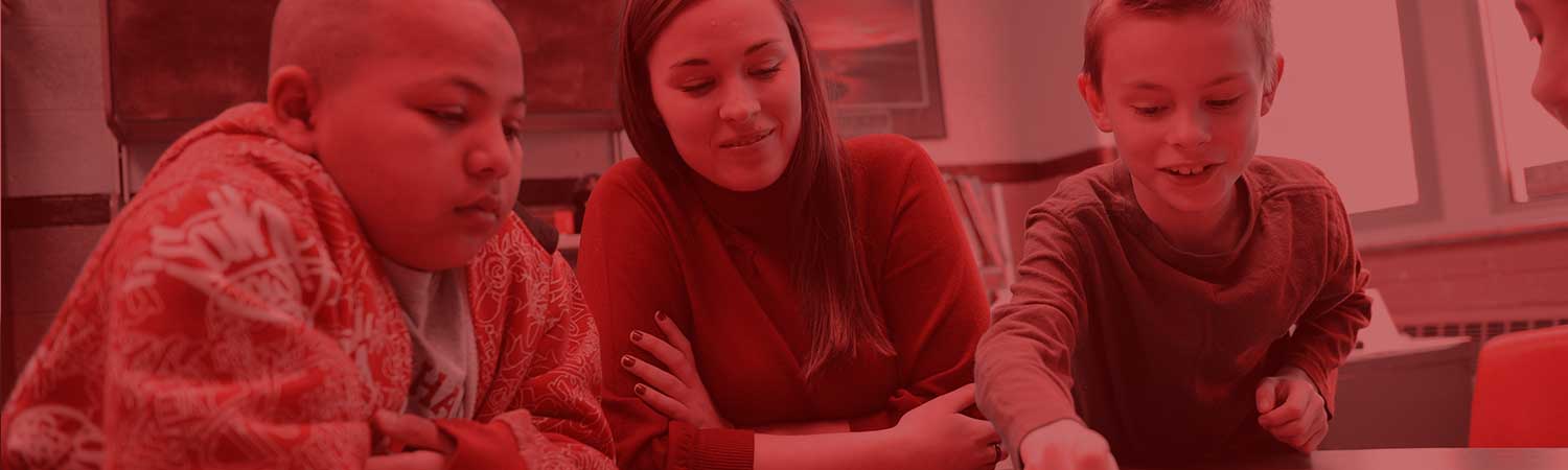 Students working with kids