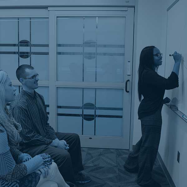 Social work students presenting and working together