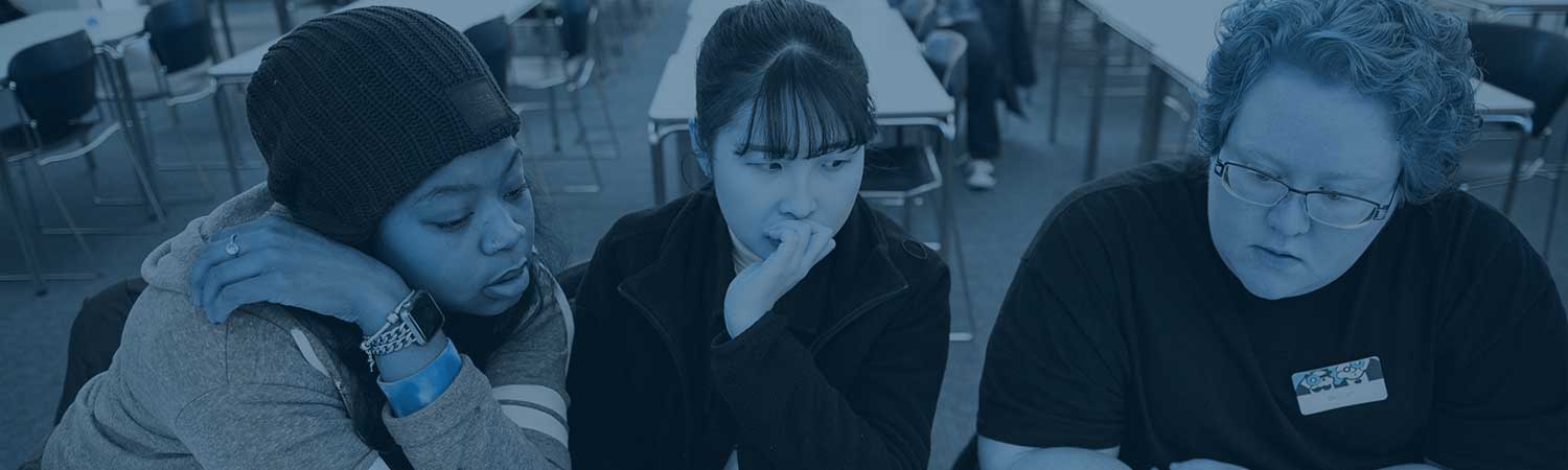 group of 3 women discussing something