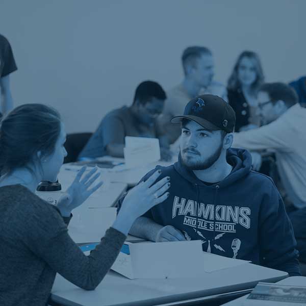 students studying with note cards during class activity