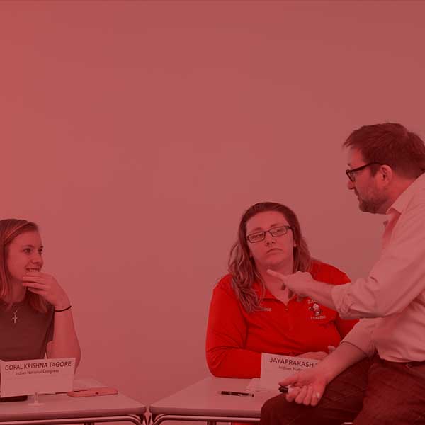 students with professor talking about sociology