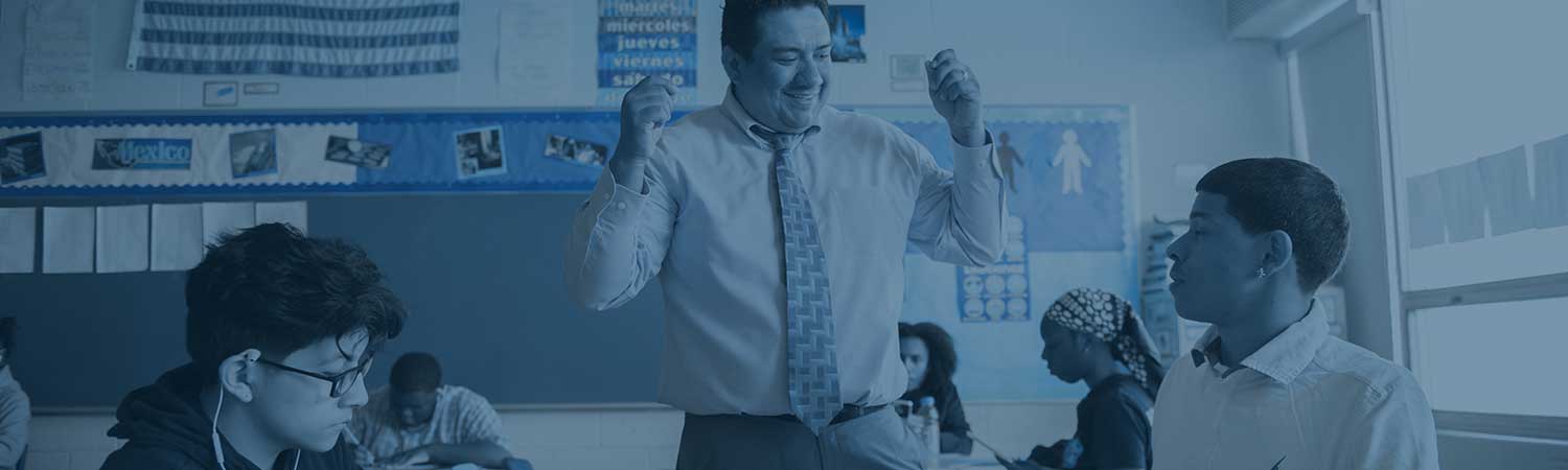 Student teacher engaging with student in class