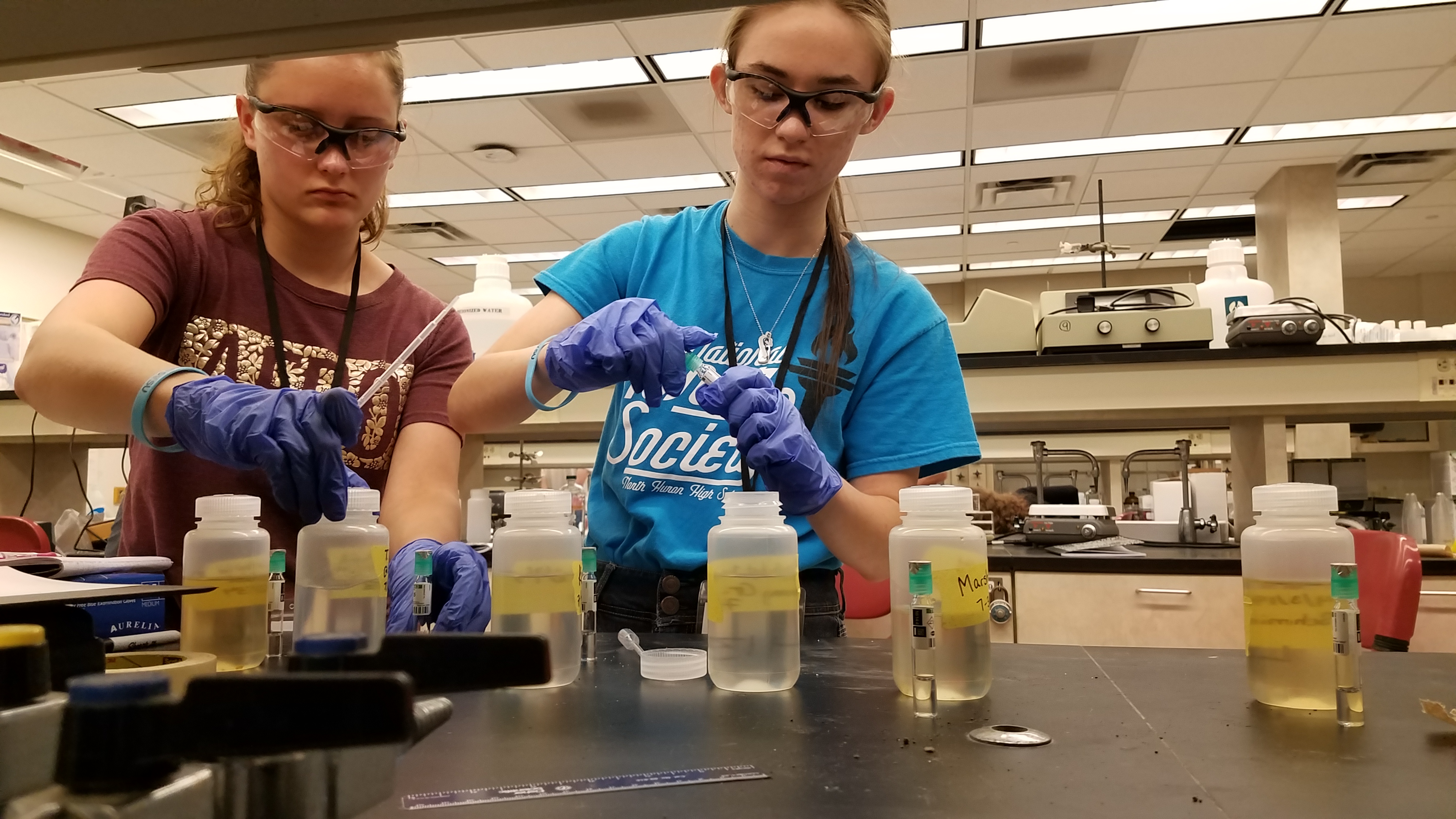 Two students working in a lab.