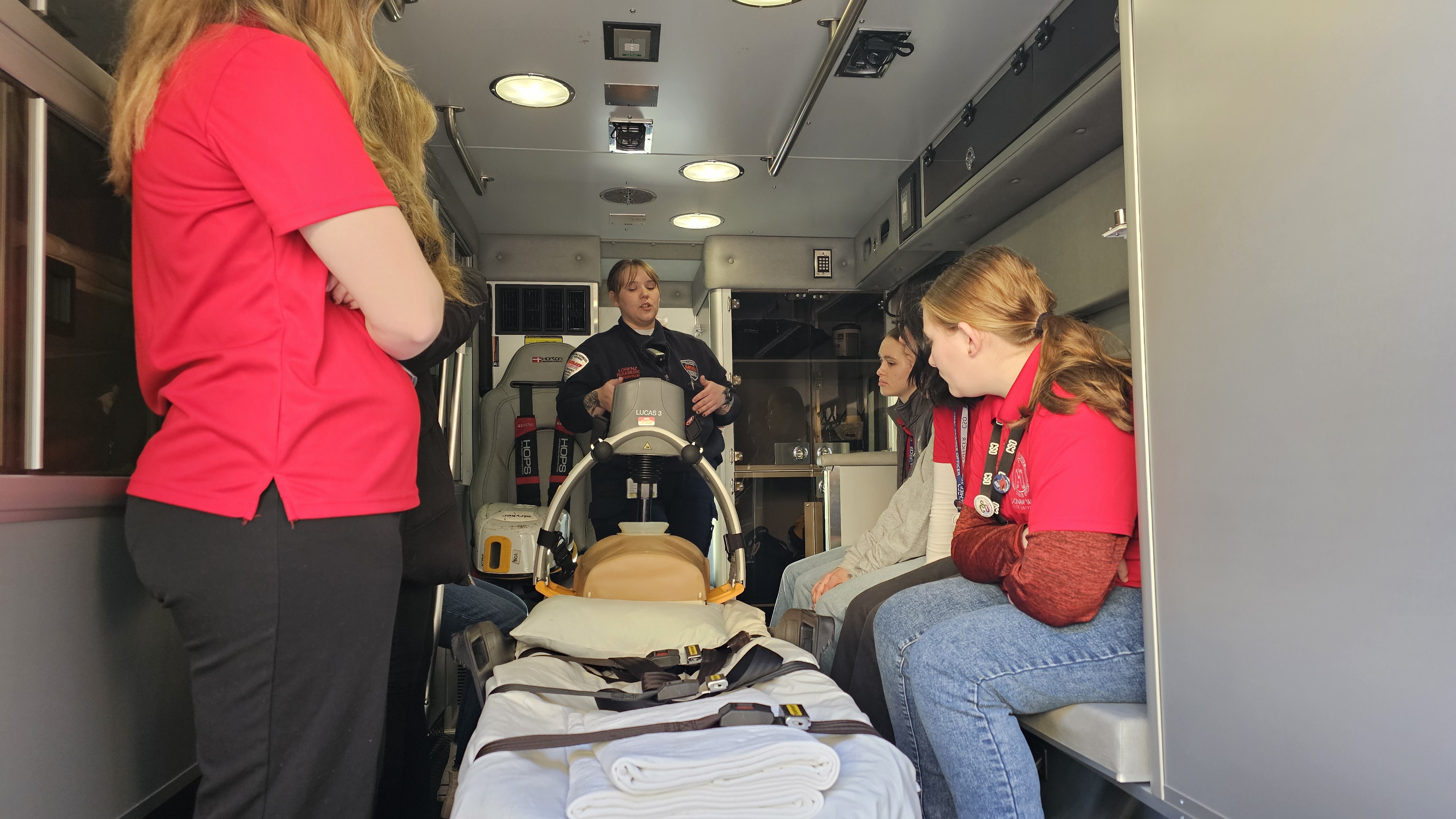 EMT showing students CPR machine