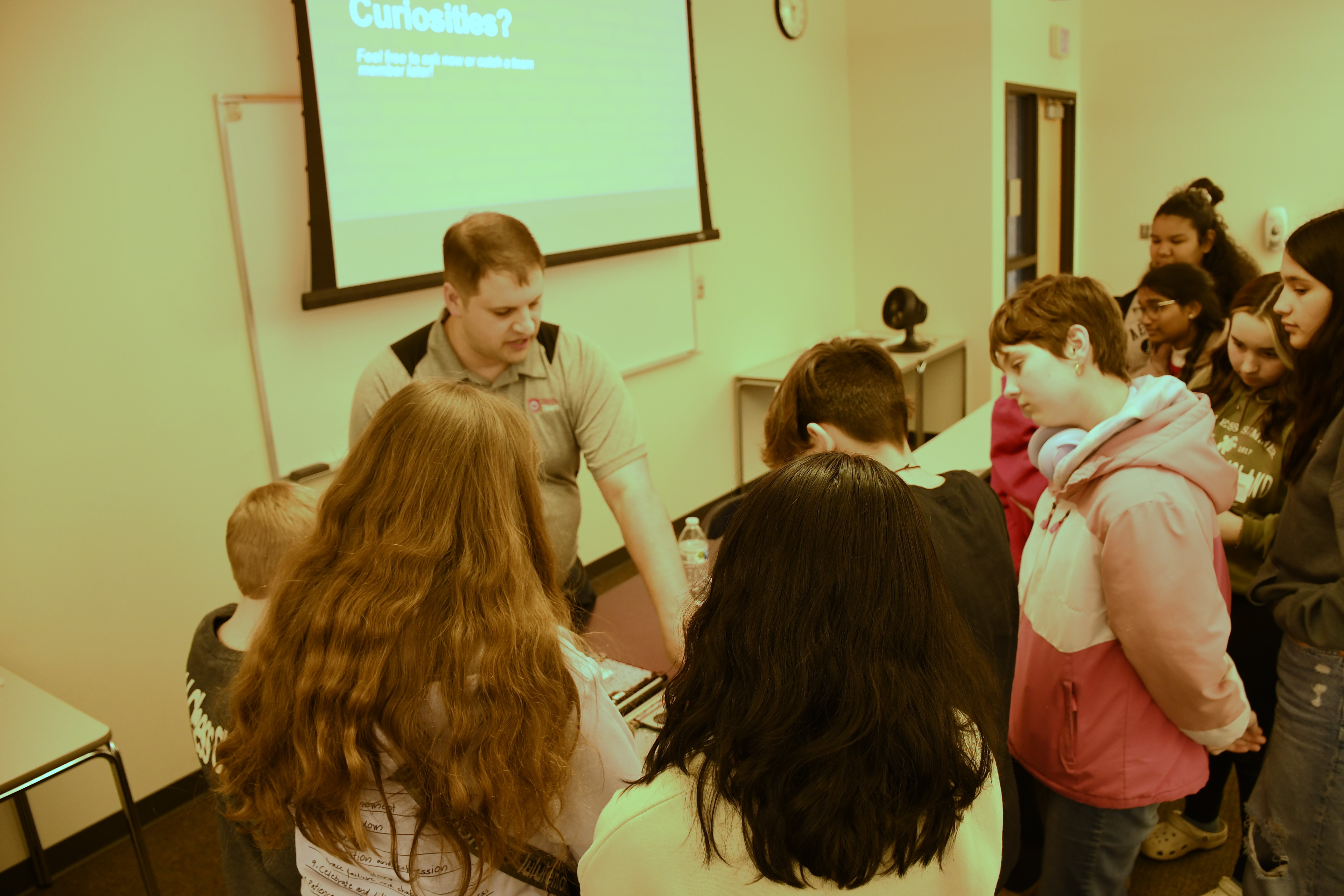 Students engaging with STEM Professional.