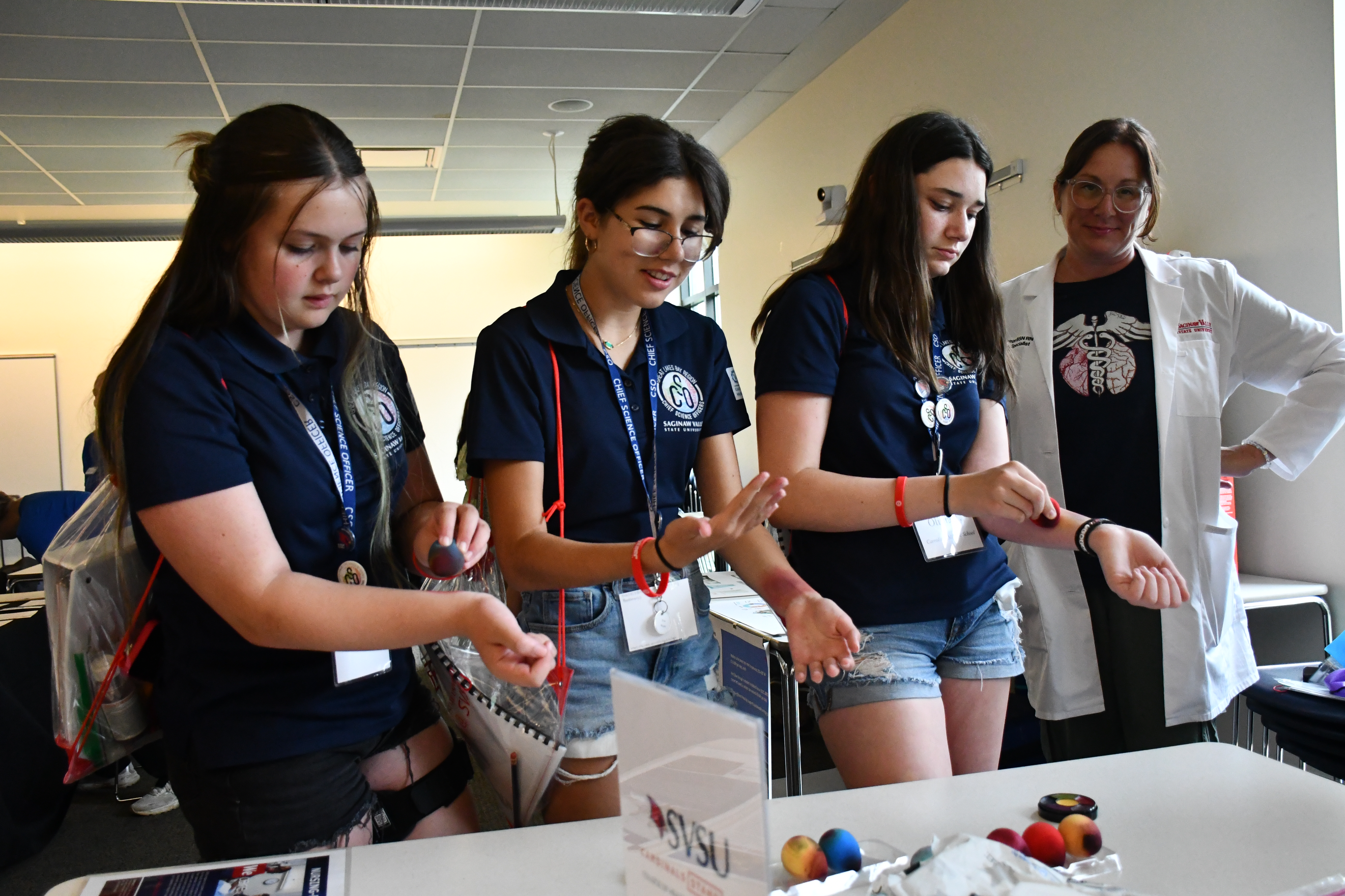 Students engaging with STEM Professional.