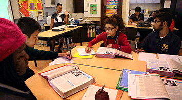High school students working in a classroom.