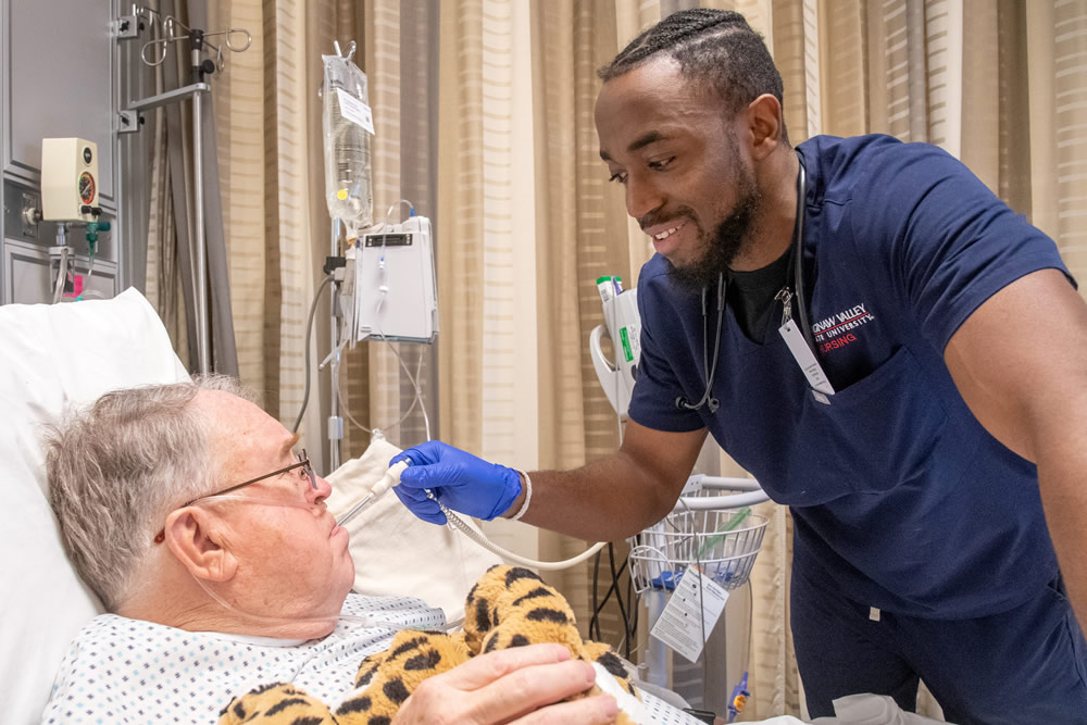Nursing student with patient