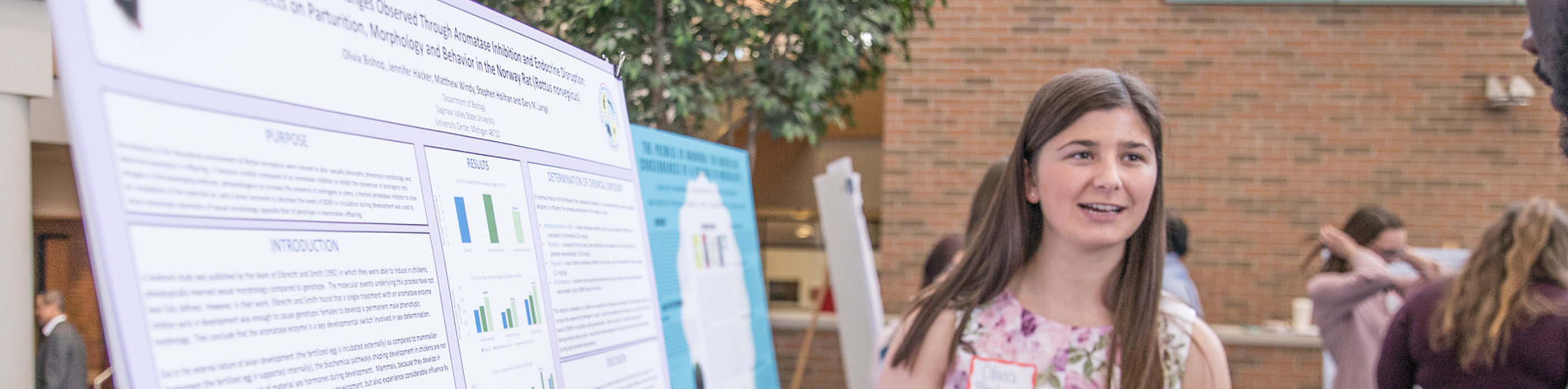 Student presenting using poster board