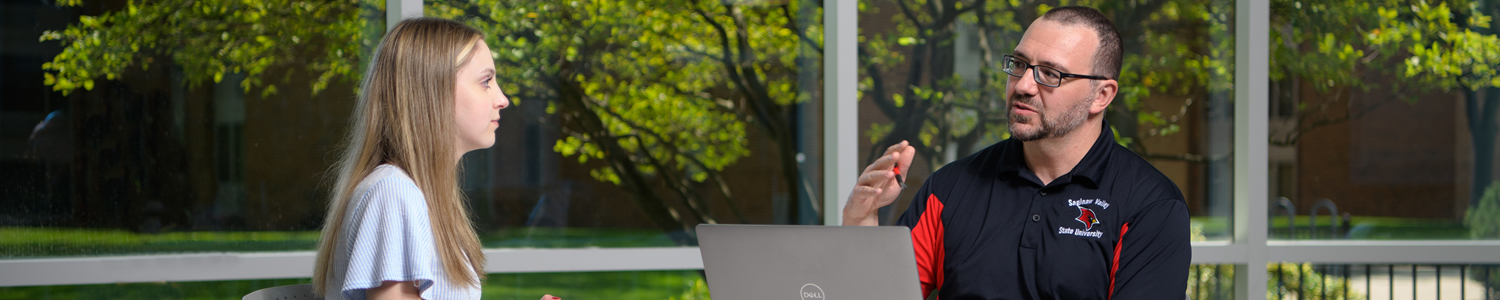 A student talking to an adult