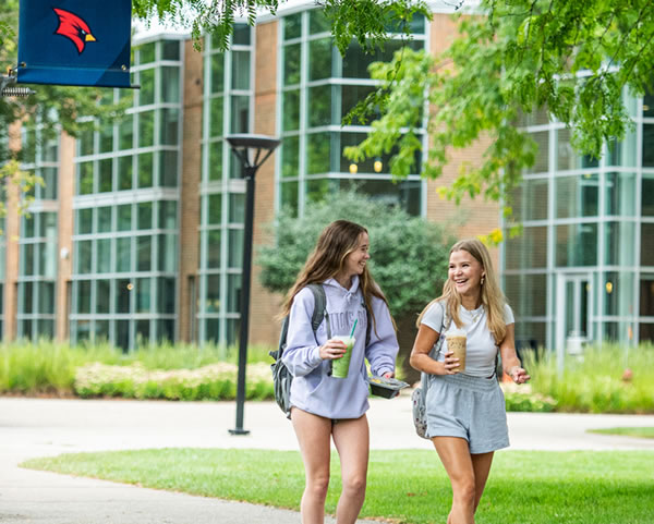 Two students walking outside