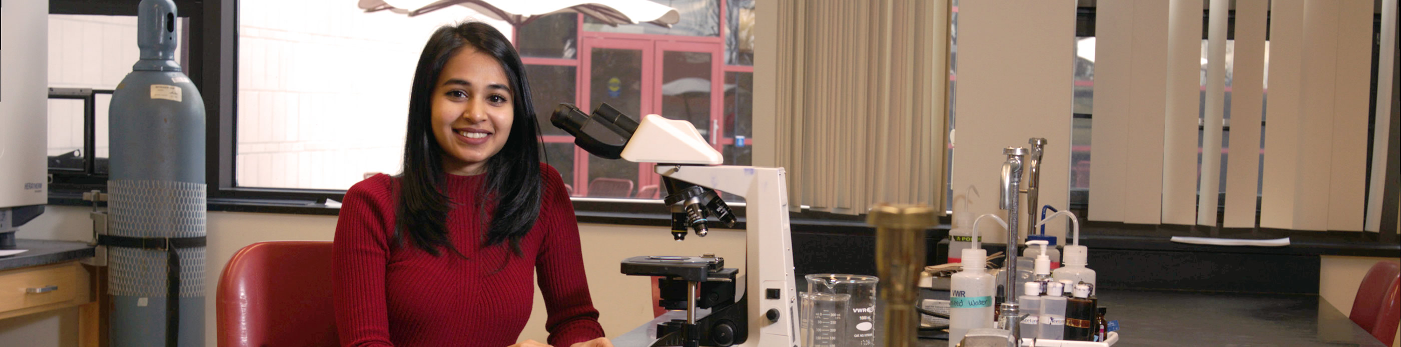 Student with microscope
