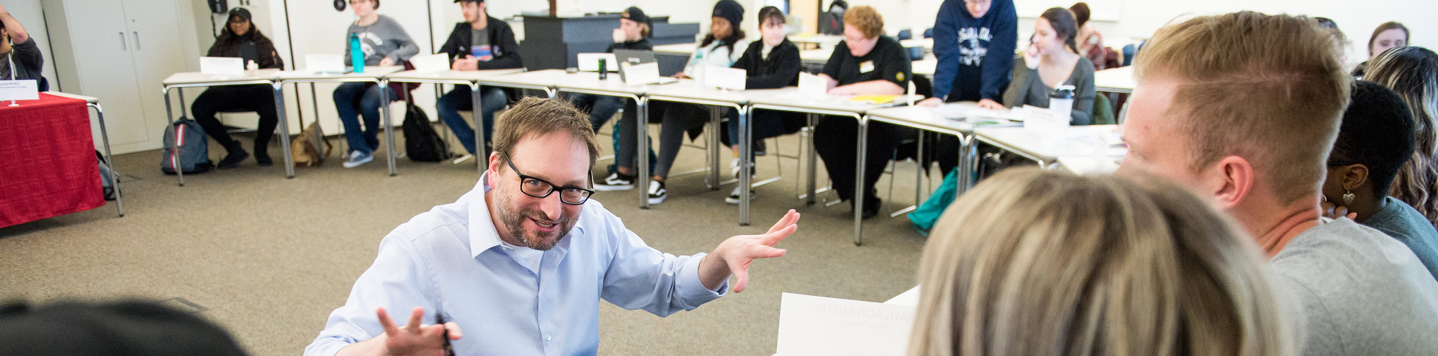 Students with professor in classroom