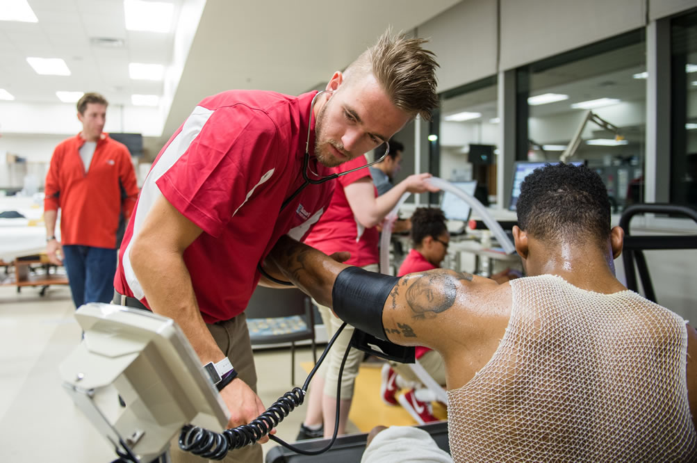 Exercise science students taking blood pressure
