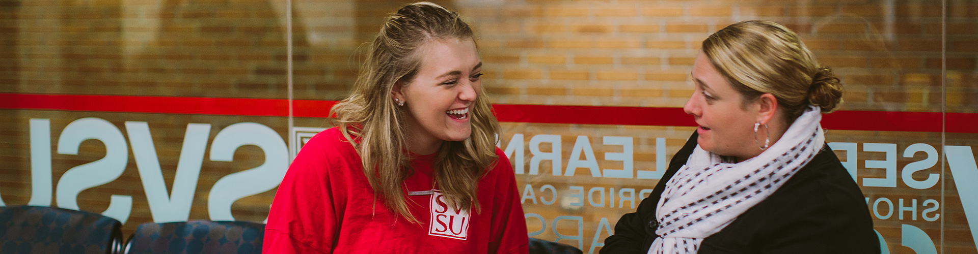 student talking to admissions director