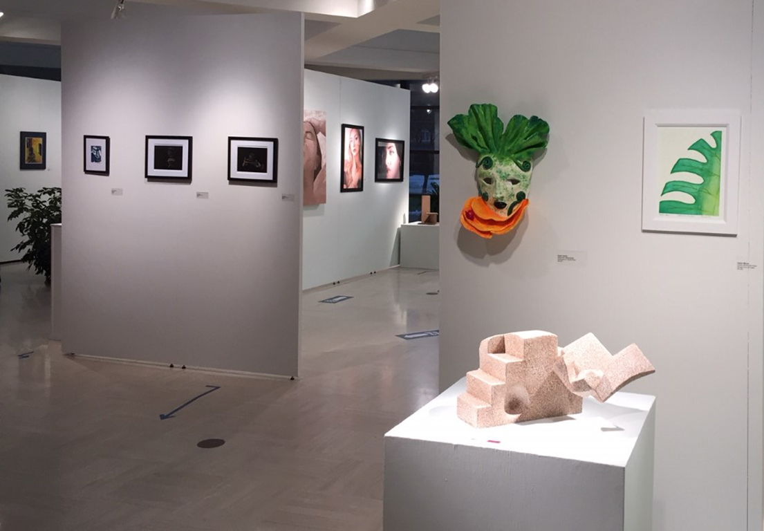 Student artwork featuring photographs and sculptures