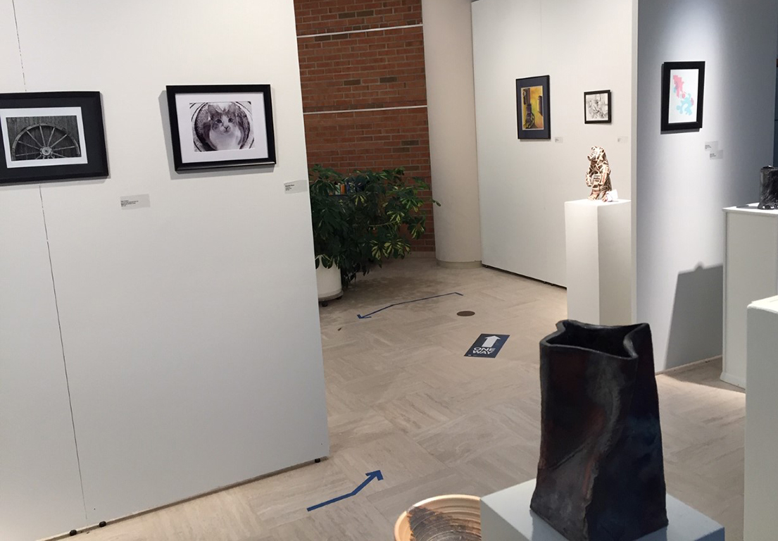 back corner featuring photographs sculptures and drawings