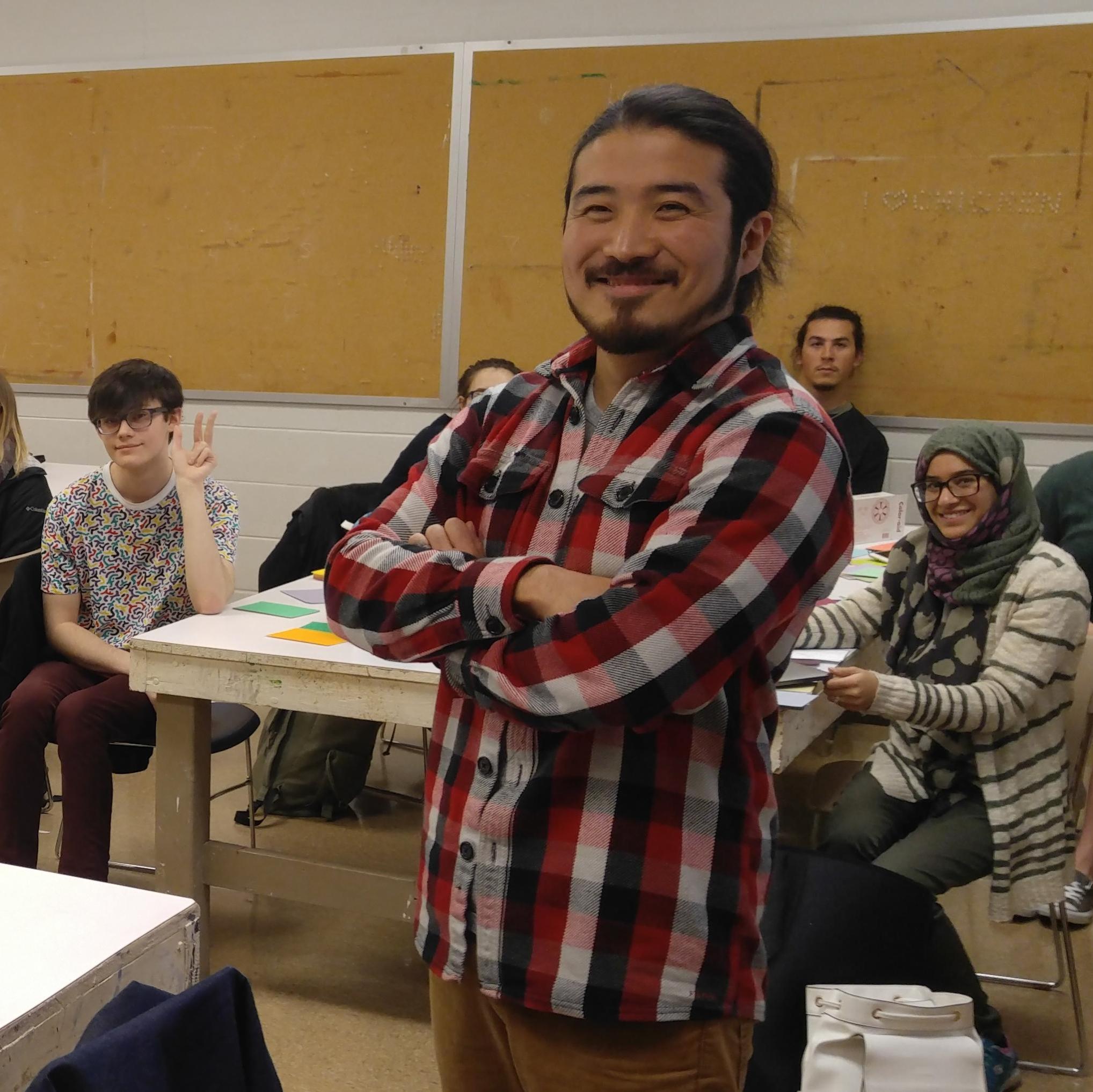 A professor teaching to students