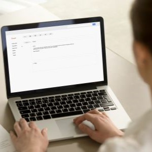 woman typing on a computer