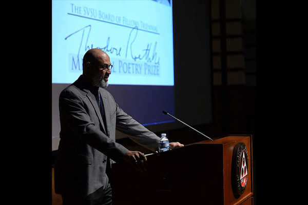 Tim Seibles at a podium